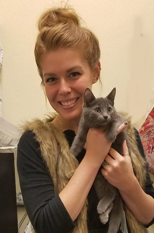 Kitten Wintergreen with her adopter