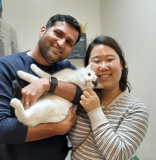 Cat with adopting family: Peppermint